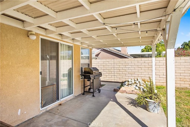 view of patio with a grill