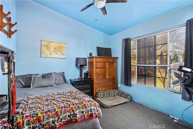 carpeted bedroom with vaulted ceiling and ceiling fan