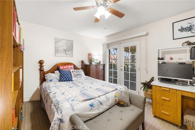 bedroom featuring access to exterior, light colored carpet, french doors, and ceiling fan