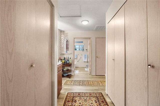 hall featuring light hardwood / wood-style floors