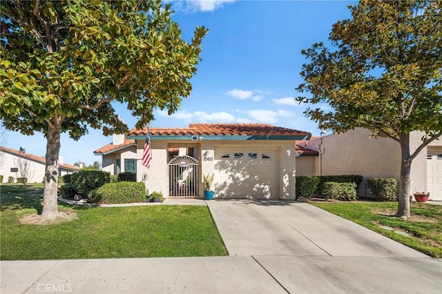 mediterranean / spanish-style home featuring a garage and a front yard