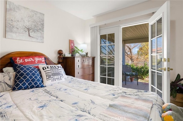 bedroom featuring access to outside and french doors