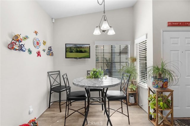 dining space with light hardwood / wood-style flooring