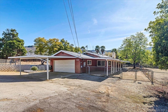 ranch-style home featuring a garage