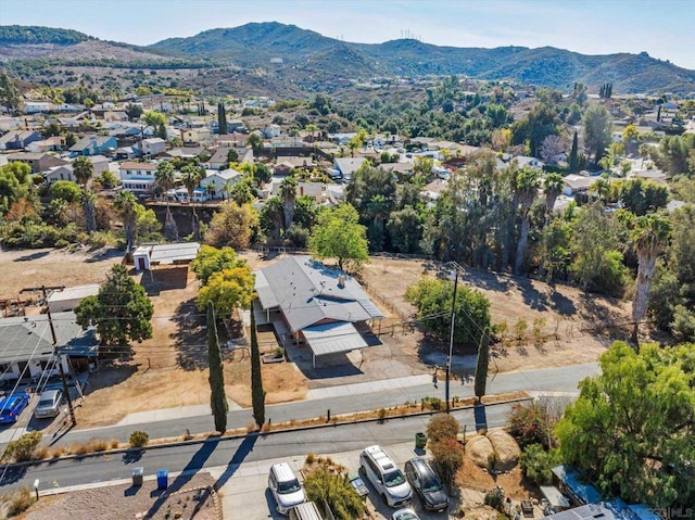 birds eye view of property with a mountain view