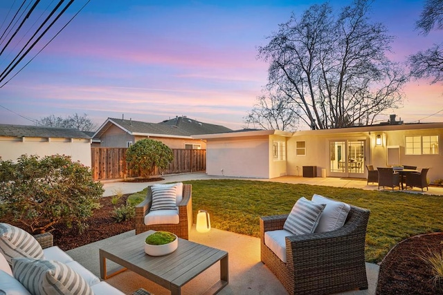 exterior space with an outdoor hangout area, french doors, and a lawn