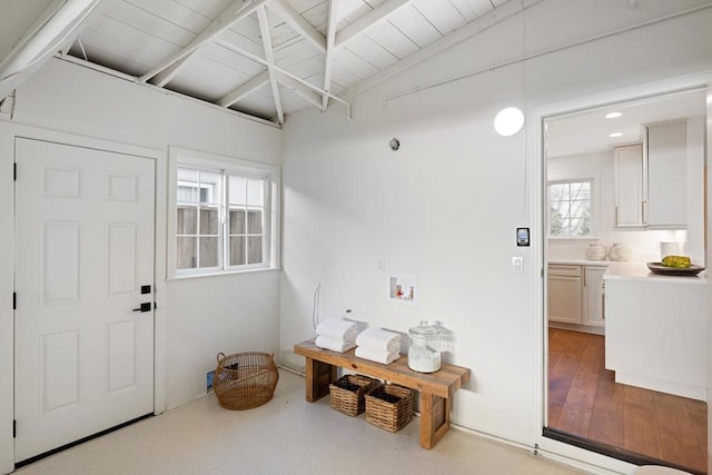 interior space featuring vaulted ceiling with beams and wood ceiling