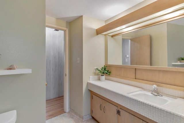 bathroom with vanity and toilet