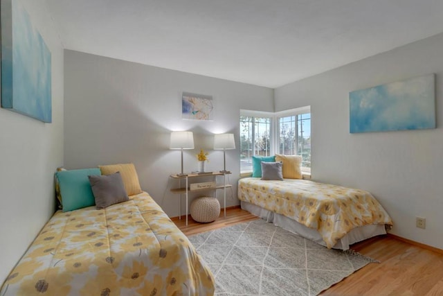 bedroom with light hardwood / wood-style floors