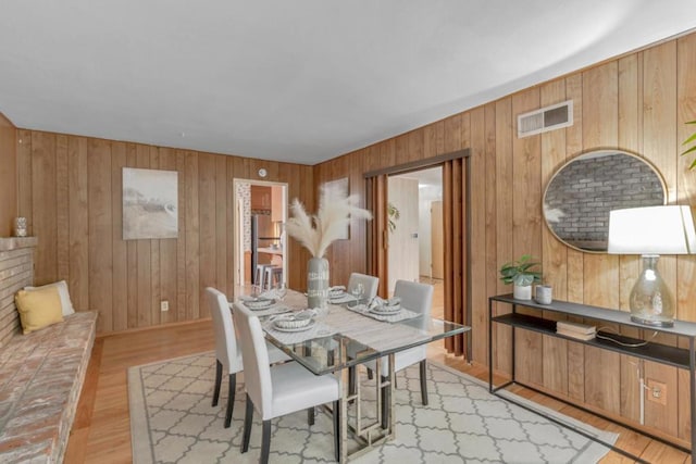 dining area with light wood-type flooring