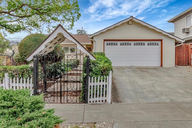 view of front of property with a garage and cooling unit