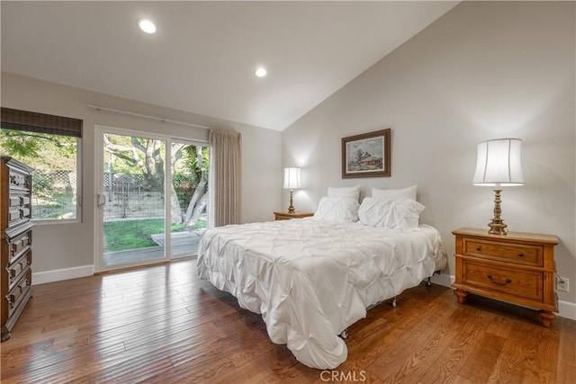 bedroom with access to exterior, dark hardwood / wood-style flooring, and vaulted ceiling