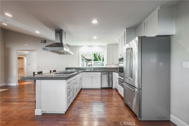 kitchen featuring stainless steel appliances, sink, island range hood, and white cabinets