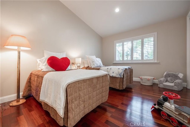 bedroom with lofted ceiling and dark wood-type flooring