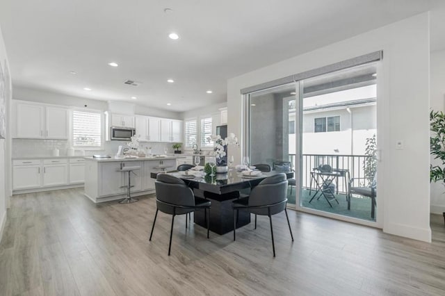 dining room with light hardwood / wood-style flooring