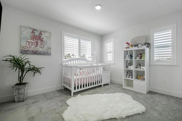 carpeted bedroom with a crib