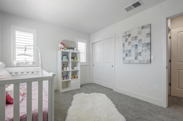 carpeted bedroom with a closet