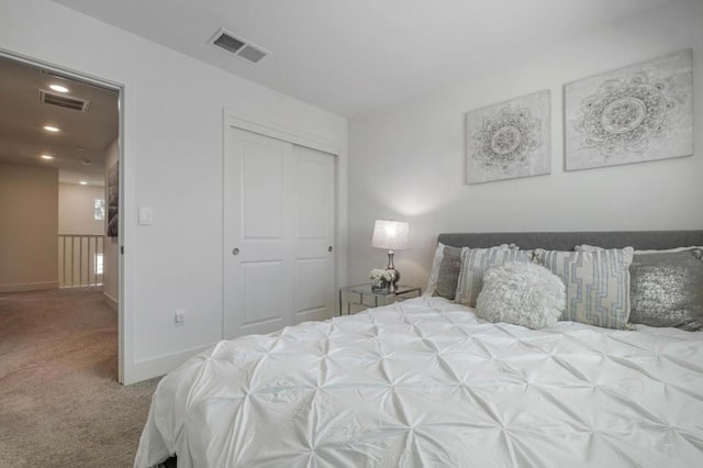 carpeted bedroom featuring a closet