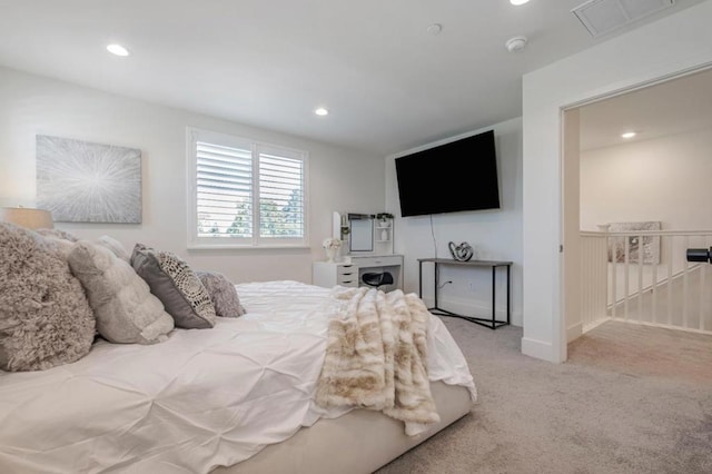 bedroom featuring light carpet