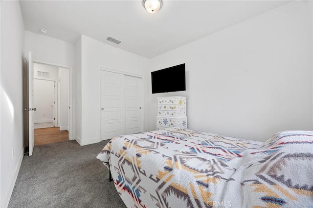 carpeted bedroom with a closet