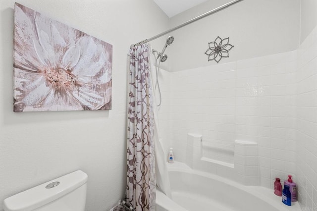 bathroom featuring toilet and shower / bath combo