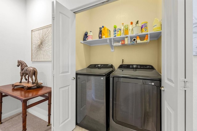 washroom with washer and dryer