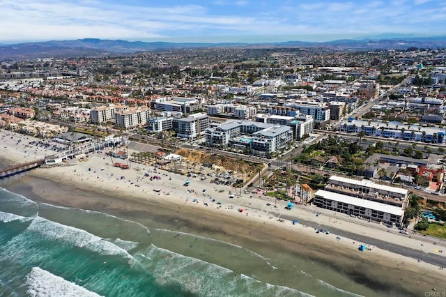 bird's eye view with a water and mountain view and a view of the beach