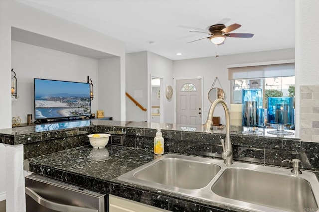 kitchen with white cabinetry, sink, stainless steel dishwasher, and ceiling fan