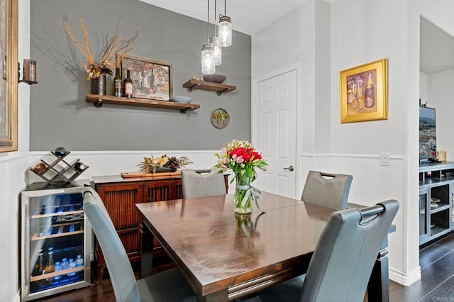 dining room featuring dark wood-type flooring and beverage cooler