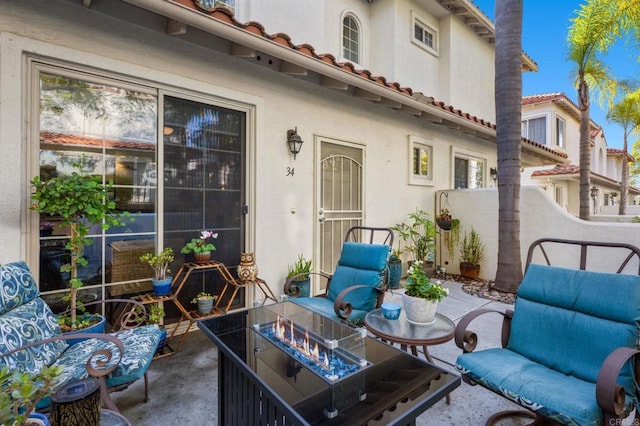 exterior space featuring an outdoor fire pit