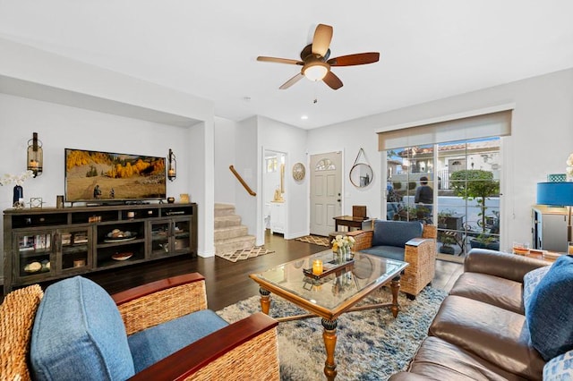 living room featuring hardwood / wood-style flooring and ceiling fan