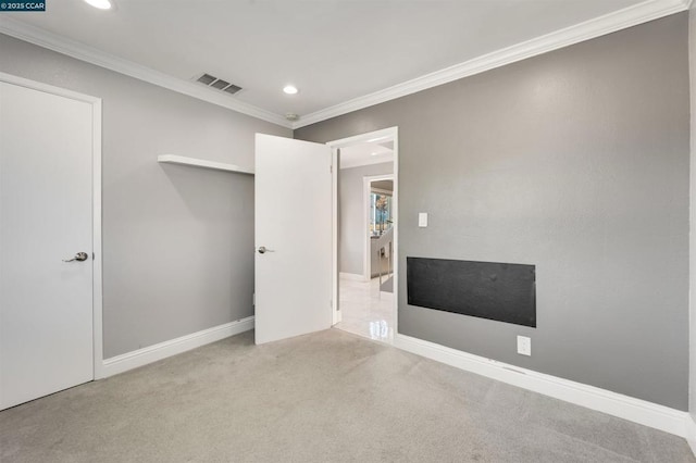 unfurnished bedroom with light carpet and ornamental molding