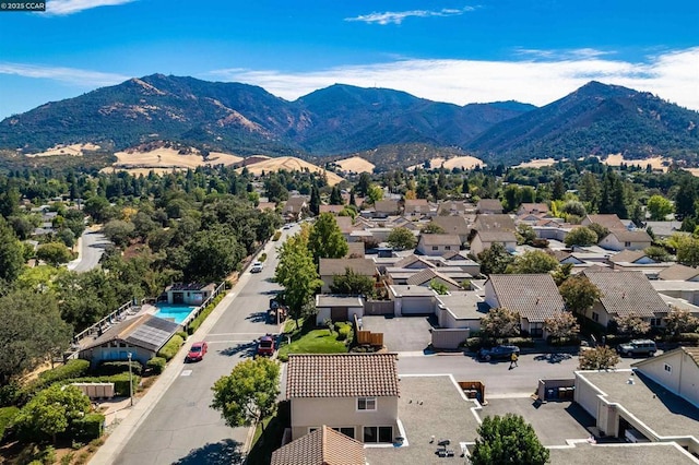 birds eye view of property featuring a mountain view