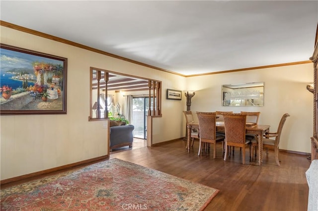 dining area with crown molding and dark hardwood / wood-style flooring