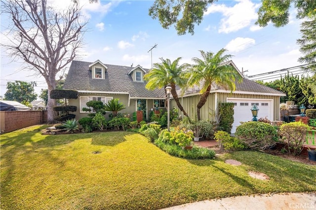 view of front of home with a garage and a front yard