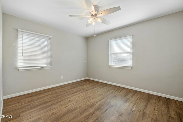 unfurnished room with hardwood / wood-style floors and ceiling fan