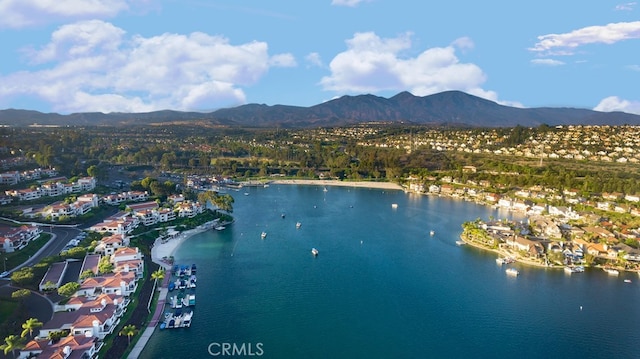 aerial view featuring a water and mountain view