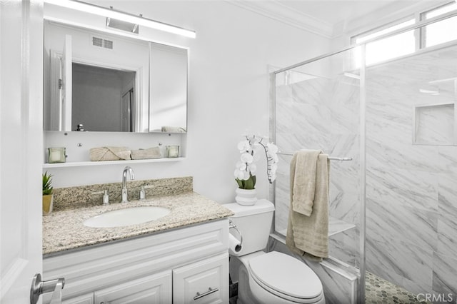 bathroom with ornamental molding, a shower with shower door, vanity, and toilet