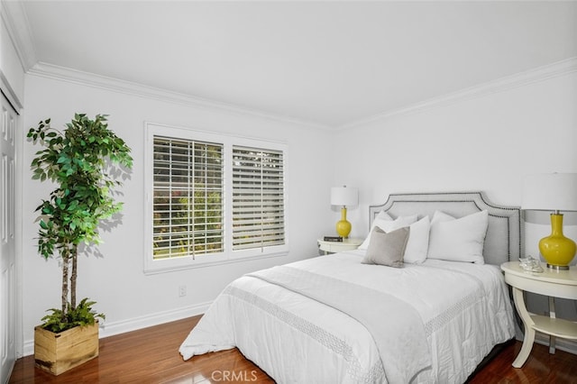 bedroom featuring ornamental molding and dark hardwood / wood-style floors