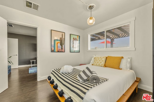 bedroom featuring dark hardwood / wood-style floors