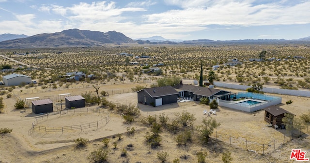 aerial view with a mountain view and a rural view