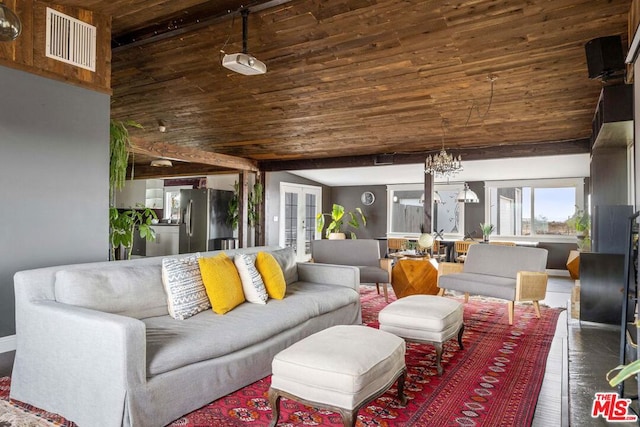 living room featuring lofted ceiling, dark hardwood / wood-style floors, a notable chandelier, wooden ceiling, and french doors