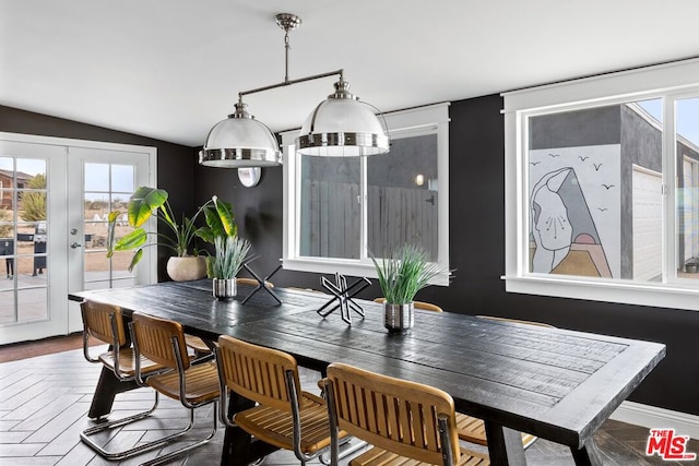 dining area featuring french doors, parquet floors, vaulted ceiling, and a wealth of natural light