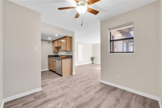 kitchen with ceiling fan, light hardwood / wood-style floors, dishwasher, and sink