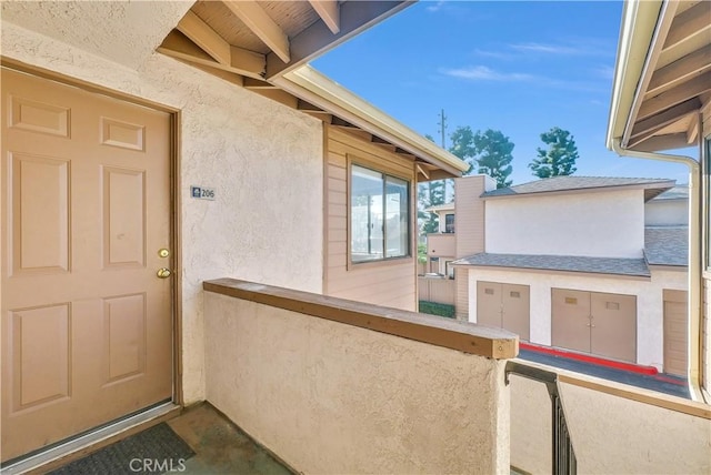 entrance to property with a balcony