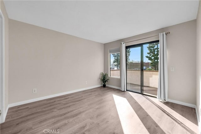 spare room featuring light hardwood / wood-style floors