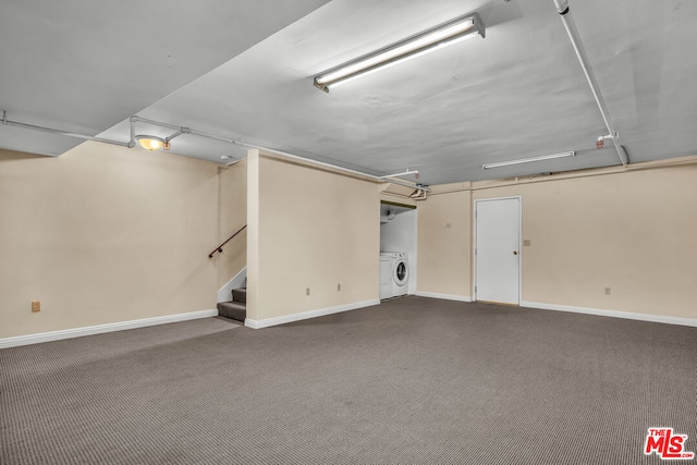 basement featuring independent washer and dryer and carpet