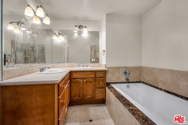 bathroom with vanity and tiled bath