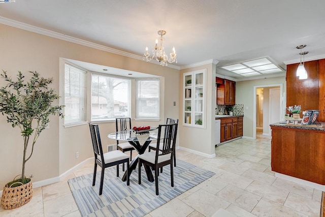 dining area with ornamental molding and a notable chandelier