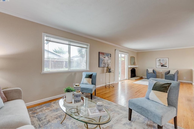 living room featuring crown molding and light hardwood / wood-style floors